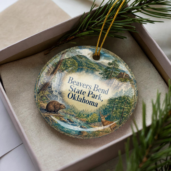 A decorative ornament in a box, featuring a scenic image of Beaver Bend State Park, Oklahoma.