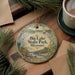 A decorative ornament with the text "Big Lake State Park, Missouri" is displayed on a wooden surface, surrounded by pine branches and a cup of coffee.