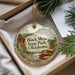 A decorative ornament with a scenic image of Black Mesa State Park, Oklahoma, hanging from a string.