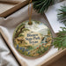 A decorative ornament with a scenic landscape of Blanco State Park, Texas, featuring a house, trees, and a waterfall.