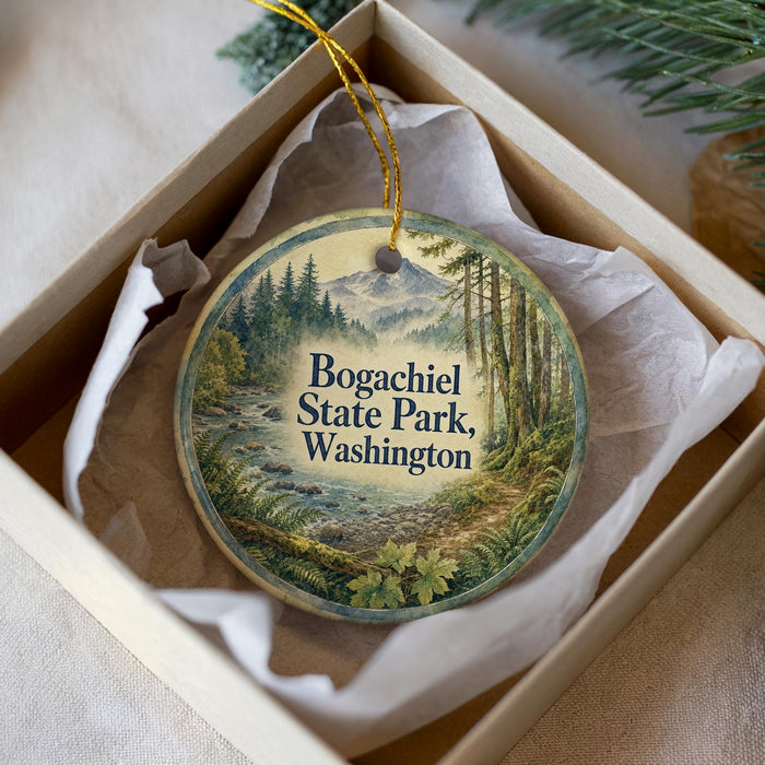 A round ornament with a scenic landscape of a forest and mountains, featuring the text "Bogachiel State Park, Washington" on it.