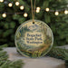 A round ornament with a scenic image of Bogachiel State Park in Washington, surrounded by pine branches and twinkling lights.