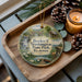 A wooden tray with a decorative ornament featuring a scenic landscape of Booker T. Washington State Park, Tennessee, and pine cones.