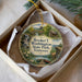 A decorative ornament in a box, featuring a scenic image of Booker T. Washington State Park, Tennessee.
