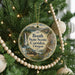A round ornament hanging on a Christmas tree, featuring a scenic image of the Booth State Scenic Corridor, Oregon.