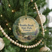 A round ornament hanging on a Christmas tree, featuring a scenic landscape of Boulder Beach State Park, Vermont.