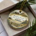 A decorative ornament in a box, featuring a scenic image of Bowring Ranch State Historical Park in Nebraska.