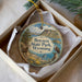 A circular ornament with a scenic image of Boysen State Park in Wyoming, featuring a mountain, lake, and wildlife.