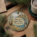 A decorative ornament featuring a scenic landscape of Boysen State Park in Wyoming, with a bird perched on a tree branch and a body of water in the background.