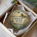A decorative ornament in a white box, featuring an illustration of a bird, a pond, and a building, with the text "Braddock Bay State Park, New York" printed on it.