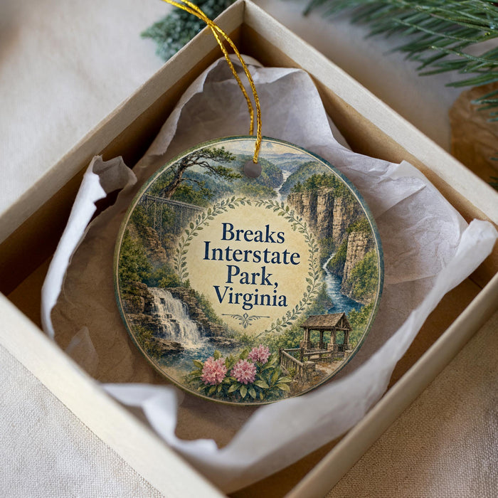A decorative ornament in a white box, featuring a scenic image of Breaks Interstate Park, Virginia.