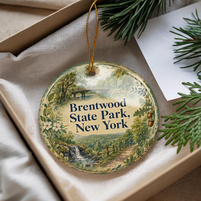 A round ornament with a scenic landscape of Brentwood State Park, New York, hanging from a string.