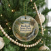 A round ornament hanging on a Christmas tree, featuring a scenic image of Bucktail State Park, Pennsylvania.