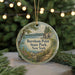 A circular ornament with a scenic image of Burnham Point State Park, New York, hanging from a string.
