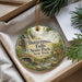 A decorative ornament with a scenic image of Butter Milk Falls State Park in New York, hanging from a string.
