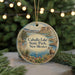 A round ornament with a scenic landscape of Caballos Lake State Park, New Mexico, featuring a mountain, lake, and desert scenery.