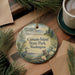 A decorative ornament featuring a serene landscape of Camano Island State Park in Washington, with a heron and pine trees in the foreground.