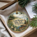 A decorative ornament with a scenic landscape of Camp Wooten State Park in Washington, featuring a cabin, pine trees, and a lake.