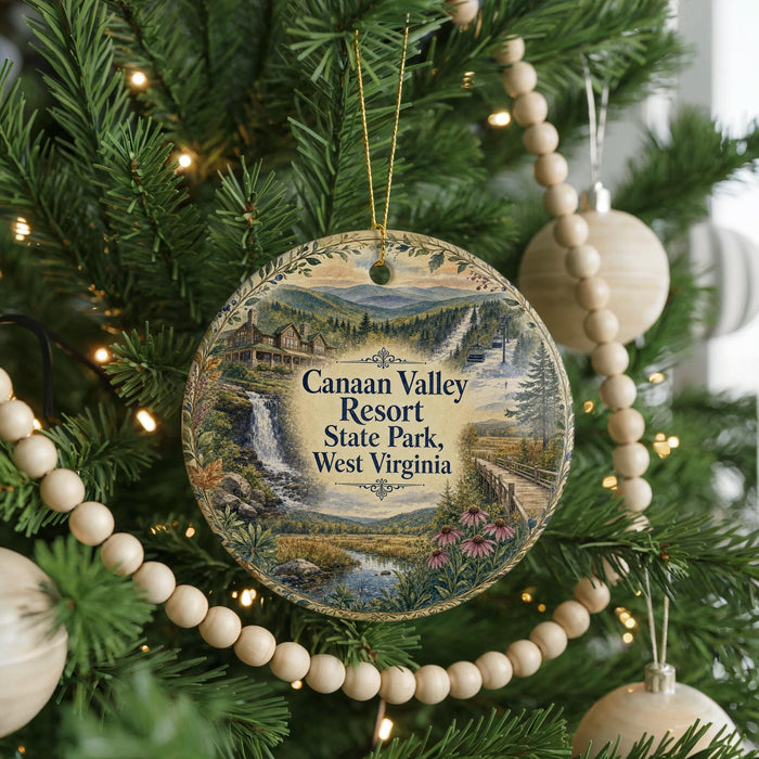 A round ornament hanging on a Christmas tree, featuring a scenic landscape with a waterfall and a cabin in the distance.