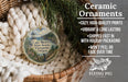 Ceramic ornaments, specifically a round ornament with a lighthouse and a scenic view of Cape Meares State Scenic Viewpoint, Oregon. The ornament is hanging from a wicker basket.