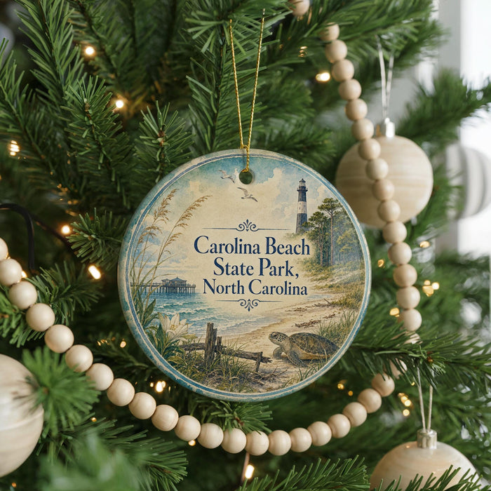 A round ornament hanging on a Christmas tree, featuring a scenic image of Carolina Beach State Park in North Carolina.