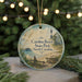 A round ornament with a lighthouse and beach scene, featuring text that reads "Carolina Beach State Park, North Carolina".