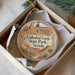 A decorative ornament in a box, featuring an illustration of the Cathedral Gorge State Park in Nevada.