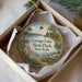 A decorative ornament in a box, featuring a scenic image of Cayuga Lake State Park in New York.
