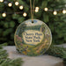 A round ornament with a scenic landscape of Cherry Plain State Park, New York, featuring a bird perched on a tree branch and a lake in the background.