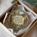 A decorative ornament in a box, featuring a scenic image of the Cimarron Canyon State Park in New Mexico.