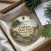 A decorative ornament with a scenic image of Codorus State Park, Pennsylvania, featuring a bird, a house, and a river.