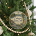 A round ornament hanging on a Christmas tree, featuring a scenic image of Codorus State Park, Pennsylvania.
