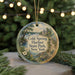 A decorative ornament with a scenic image of Cold Spring Harbor State Park, New York, featuring a path, a building, and a body of water.