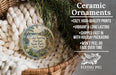Ceramic ornaments, featuring a detailed illustration of Cold Spring Harbor State Park in New York, are displayed in a wicker basket. The text highlights the ornaments as "Ceramic Ornaments" with a description of their features, including "Cozy, High-quality Prints", "Vibrant & Long Lasting", "Shipped Fast in with Holiday Packaging", and " Won't Peel or Fade Over Time".