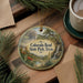 A decorative ornament featuring a scenic landscape of Colorado Bend State Park, Texas, with a waterfall and desert backdrop.