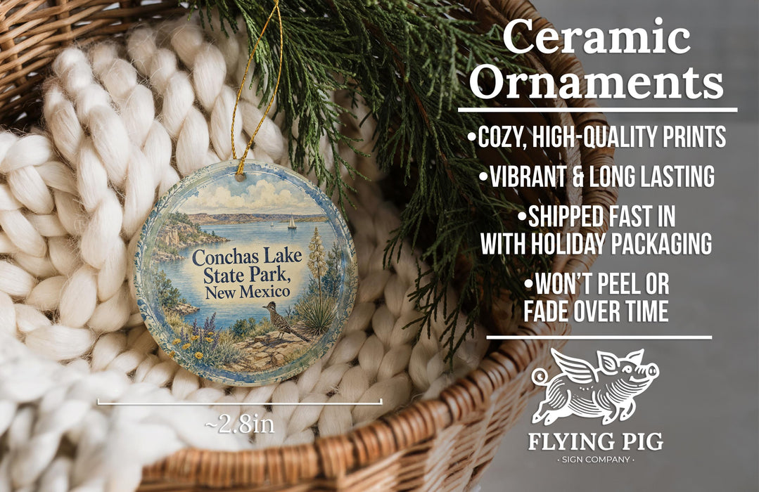 Ceramic ornaments, specifically those shaped like the Conchas Lake State Park in New Mexico, are displayed in a basket. The ornaments are described as cozy, high-quality prints, vibrant, and long-lasting, and are shipped fast in holiday packaging. They are not to be peeled or faded over time.