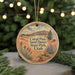 A round ornament with a scenic landscape of a desert and mountains, featuring the text "Coral Pink Sand Dunes State Park, Utah".