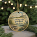 A round ornament with a lighthouse and a bird, hanging on a string, with the text "Corson's Inlet State Park, New Jersey" printed on it.