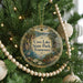 A round ornament hanging on a Christmas tree, featuring a scenic landscape of Cove Lake State Park, Tennessee.