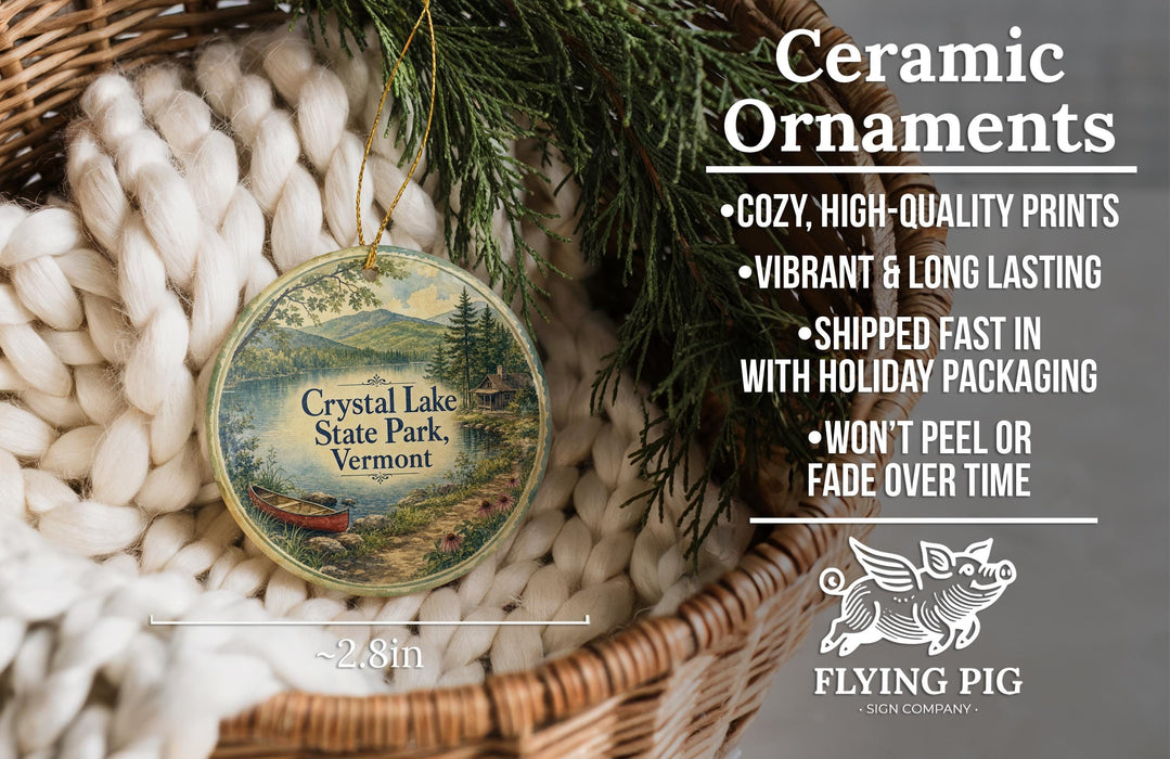 Ceramic ornaments, featuring a scenic image of Crystal Lake State Park, Vermont, hanging from a wicker basket.