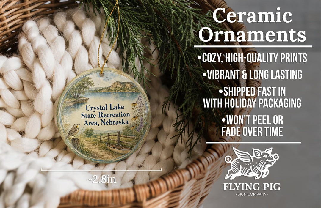Ceramic ornaments, featuring a scenic image of Crystal Lake State Recreation Area, Nebraska, hanging from a wicker basket.