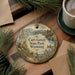 A decorative ornament featuring a scenic landscape of Curt Gowdy State Park, Wyoming, with a mountain backdrop, a lake, and a bird in flight.