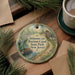 A decorative ornament featuring a scenic image of Delaware and Raritan Canal State Park, New Jersey, with a boat on the water and a house in the background.