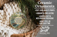 Ceramic ornaments, specifically a decorative piece with a scenic image of Delaware and Raritan Canal State Park, New Jersey, hanging from a wicker basket.
