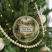 A round ornament hanging on a Christmas tree, featuring an illustration of Delaware Canal State Park, Pennsylvania.