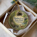 A circular ornament with a scenic image of Dunbar Cave State Park, Tennessee, featuring a deer and a bridge.