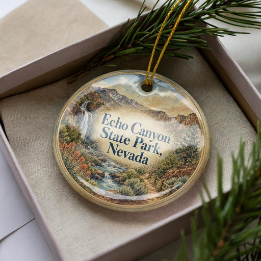 A decorative ornament in a box, featuring a scenic landscape of Echo Canyon State Park, Nevada.