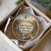 A round ornament with a scenic image of Echo Canyon State Park, Nevada, hanging from a string.