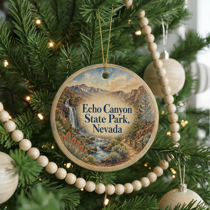 A circular ornament hanging on a Christmas tree, featuring a scenic image of Echo Canyon State Park, Nevada.