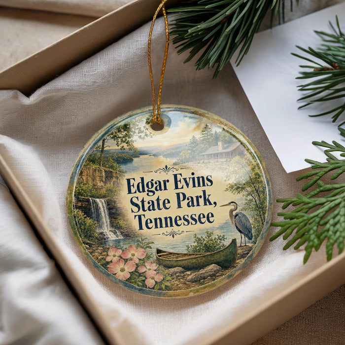 A decorative ornament with a scenic image of Edgar Evans State Park, Tennessee, hanging from a string.